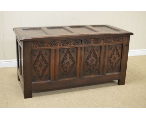 A late 17th Century oak Coffer with sunken four panel lid above arch frieze and four diamond carved panels, 4ft
