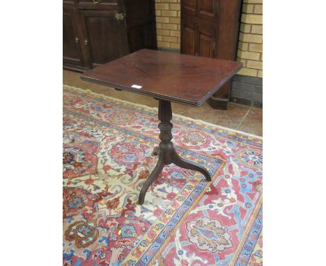 A 19th Century mahogany Pillar Table, the moulded rectangular top above a turned and leafage carved column, on a swept turned