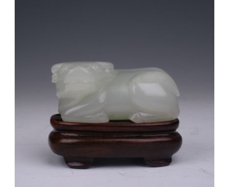 A good Chinese pale Jade Buffalo, 18th/19th Century, of very pale celadon to almost white colour, carved in the Ming style re