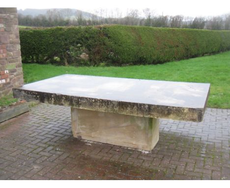 A large Portuguese sandstone rectangular Table on large rectangular column plinth, 8ft 1in x 4ft 4in