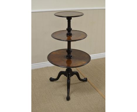 A Georgian mahogany circular three tier graduated Dumb Waiter on turned and spiral fluted column and tripod base fitted caste