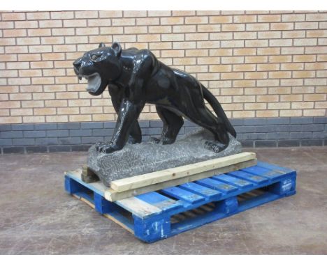 A Chinese black stone Statue of a Panther, 4ft L x 2ft 10in H