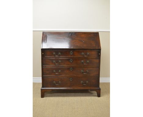 A George III mahogany Bureau with fitted interior of small drawers, pigeon holes and door, four long graduated drawers beneat