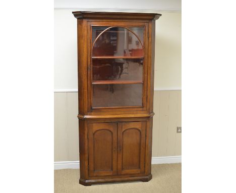 A 19th Century oak Double Corner Cupboard with single glazed door above a pair of arch panelled doors, 6ft 5in