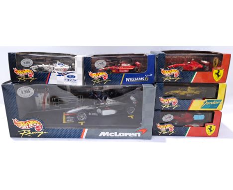 Hot Wheels, a boxed group of F1 Racing Scale Models. Includes 1999 Ferrari F399 with others. Although unchecked for completen