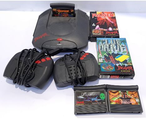 A unboxed Atari Jaguar Games Console with a Collection of boxed &amp; unboxed Video Games. Includes "Raiden" with others. Alt