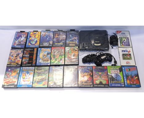 A unboxed Sega Mega Drive Games Console and Video Games. Includes "Battletoads" with others. Although unchecked for completen