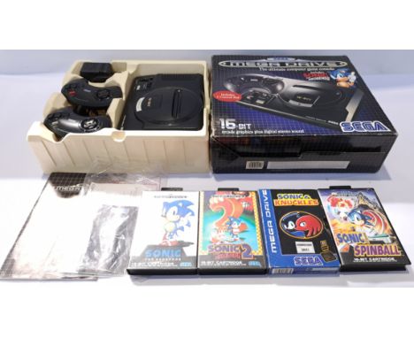 A boxed Sega Mega Drive Game Console &amp; Games. Includes "Sonic the Hedgehog" with others. Although unchecked for completen