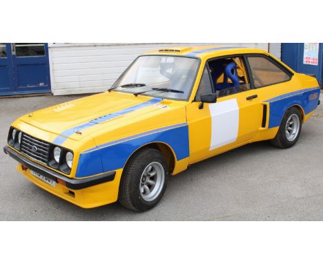 A genuine MK2 RS2000 Escort 2 door shell. All replaced body panels from X press panels, with series X arches, and body stand 