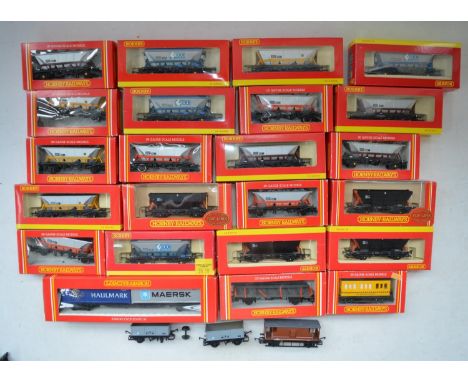 Twenty three boxed OO gauge Hornby goods wagons to include Hopper and Container Wagons, 3 unboxed wagons (one with damaged wh