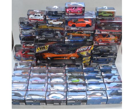 Large collection of boxed diecast Fast &amp; Furious car models by Jada in 1/18th and 1/24th scales. Also included a large sc