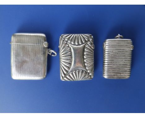 A small Birmingahm silver vesta with reeded decoration - 1892 and two others with Birmingham marks. (3)
