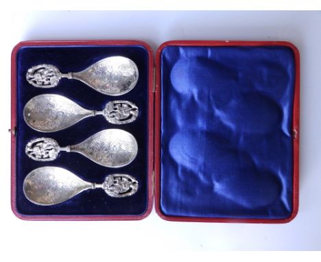 A cased set of four continental white metal caddy spoons
