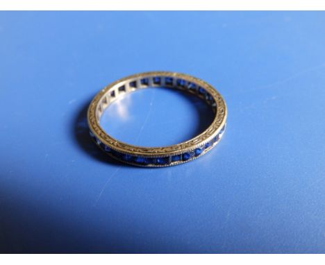 An early 20thC '9c' sapphire eternity ring.  Finger size V/W.
