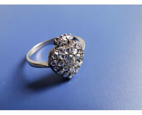 A Victorian  diamond set heart locket ring, pave set with a central old cut stone surrounded by numerous rose cuts, a detacha