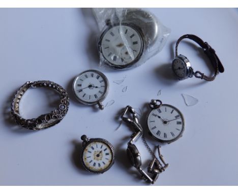 Three silver pocket watches and other items.