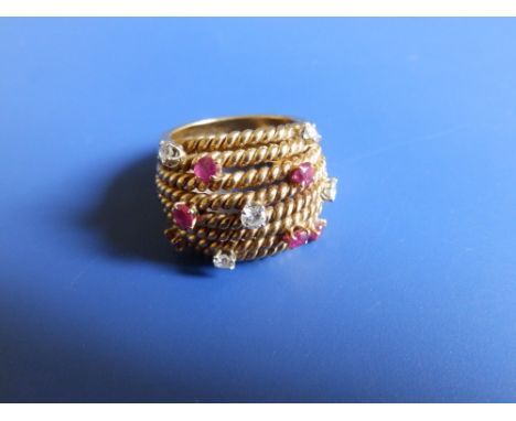 A modern 18ct gold dress ring  of rope twist design set with small brilliant cut diamonds &amp; rubies - 'HGM'.  Finger size 