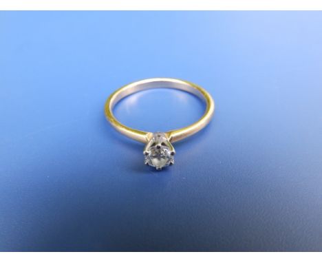 A small modern diamond solitaire ring , claw set on 18ct gold shank, accompanied by a GIA certificate stating the stone to we