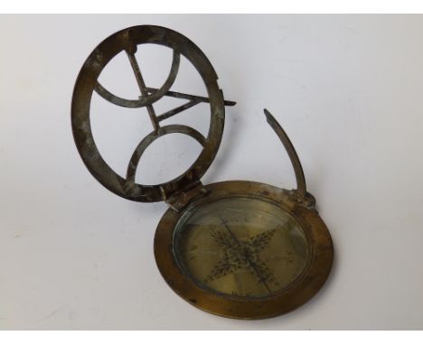 A 19thC brass compass by G. Adams, London.