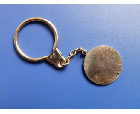 A 9ct gold key ring by Payton Pepper Ltd, retailed by Asprey.