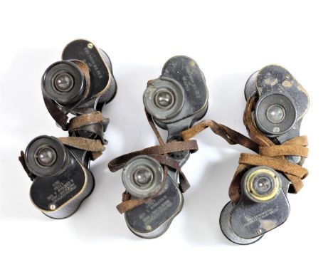 A pair of Kershaw WWII British army prism  No.2 Mk II binoculars, dated 1938, another pair dated 1940 and an American pair wi