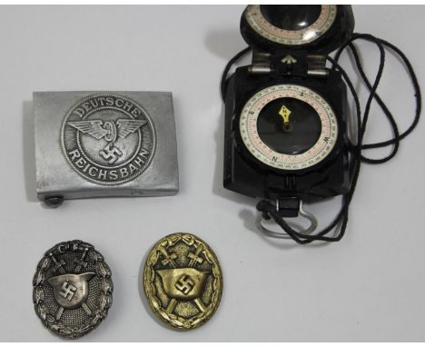 German Third Reich  Reichsbahn belt buckle, stamped R.Z.M. M34/2 to the reverse, a Condor Legion silver wound badge and a bra