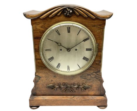 A William IV c1820 twin fusee bracket clock in a rosewood case with a crested top and applied carving to the front, with a ch