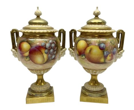 Pair of mid 20th century Royal Worcester vases and covers decorated by Alan Telford, each of ovoid form with twin mask mounte