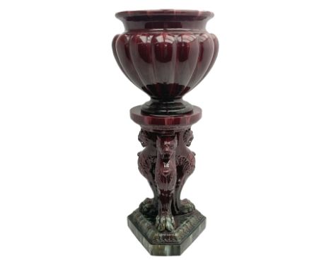 Large and impressive 19th century oxblood jardiniere on stand, in the manner of Burmantofts Leeds and Massier, the fluted pla
