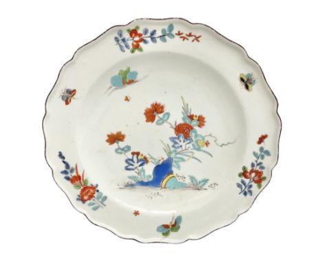 Mid 18th century Chelsea red anchor period plate, circa 1752-1754, hand painted in enamels in the Kakiemon palette with flowe
