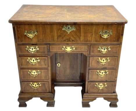 Early 18th century Queen Anne figured walnut kneehole desk with secretaire drawer, moulded and book matched top with walnut b