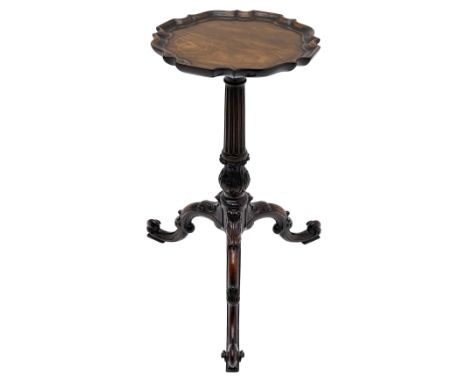 In the manner of Thomas Chippendale - mahogany tripod wine table, moulded pie crust border top on fluted stem with acanthus l