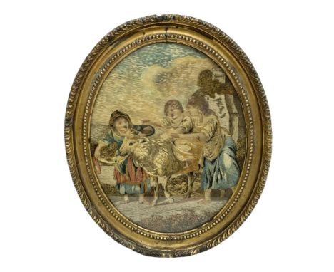 Regency wool and silkwork picture, of oval form depicting three young children and a sheep, within a rural landscape with bui