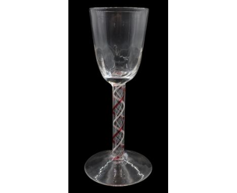 18th century drinking glass, probably Continental, the rounded funnel bowl with moulded part fluting upon a colour twist stem