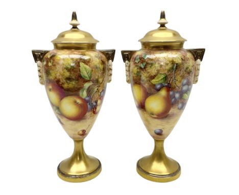 Pair of mid/late 20th century Royal Worcester vases and covers decorated by John Freeman, each of slender ovoid form with twi