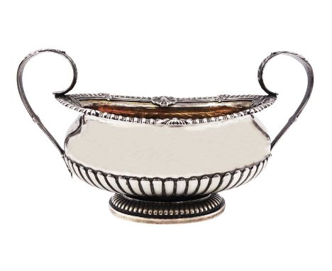 George III silver twin handled sucrier, of part fluted oval form with oblique gadrooned rim with shell and palmette cast deta