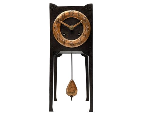 A German Arts and Crafts 'Gesamtkunstwerk' mantle clock c1890 in a square formed iron case with abalone incised triangles to 