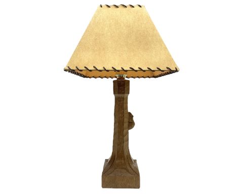 'Mouseman' tooled oak table lamp, the octagonal tapered stem carved with mouse signature, with shade, by Robert Thompson of K