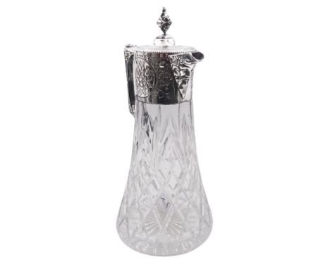 Modern silver mounted cut glass claret jug, in the Victorian style, the tapering cylindrical body with foliate embossed colla