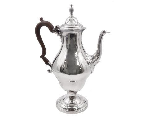 George III silver coffee pot, of bellied form with scroll detail to spout, urn finial to the hinged cover and wooden scroll h