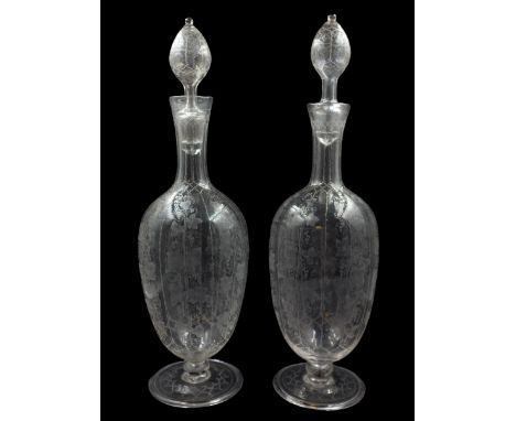 Pair of Edwardian Stourbridge style glass claret decanters and stoppers, of ovoid form with tall tapering necks, supporting h