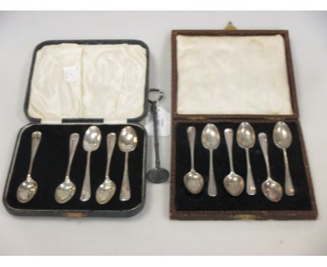 A set of six and another set of five silver coffee spoons and an electroplate swizzel stick  