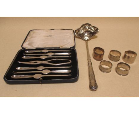 Four silver napkin rings, a punch ladle and cased lobster picks  