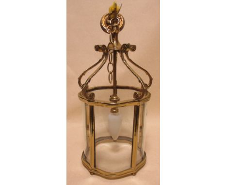 An 18th century style brass framed hall lantern, with hanging chains and mount  