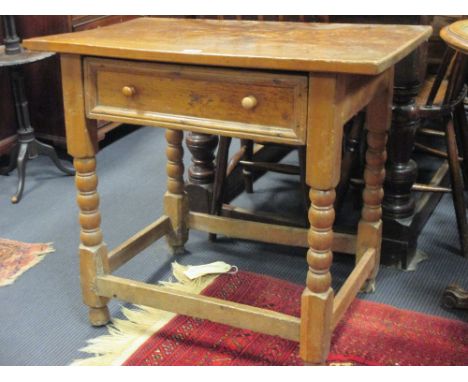 A James II elm side table with a single drawer on bobbin turned legs, with alterations 72 x 81 x 49cm  Old restoration includ