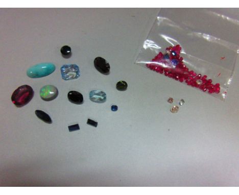 A quantity of loose cut precious stones, to include a 0.35ct old round brilliant cut diamond, a 1.60ct aquamarine, also opal,