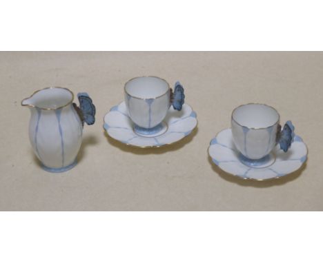 An Aynsley part tea service decorated in blue and gilt with the cups having butterfly handles (26)  