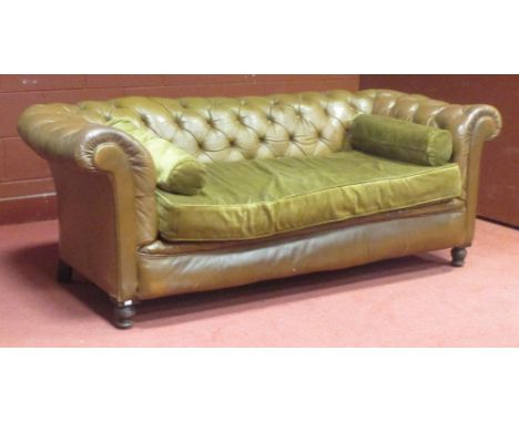 A Victoian tan leather upholstered button back Chesterfield sofa, on turned feet, 200 x 82cm  