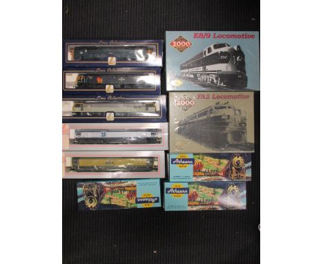 Five Lima model locomotives (boxed), two Proto 2000 series locomotives (E8/9 and FA2), and three Athearn model train sets (33