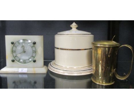 An agate clock, a Stilton dish and cover and a '1673' brass tankard  
